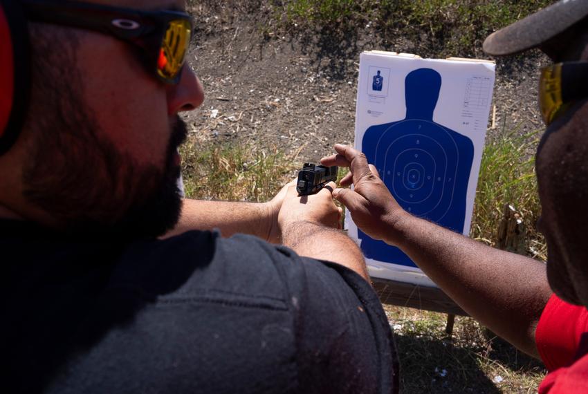 Michael Cargill, owner of Central Texas Gun Works, instructs a student about their posture and technique during a license-to-carry class at the Lone Star Gun Range in Lockhart on Aug. 5, 2023.