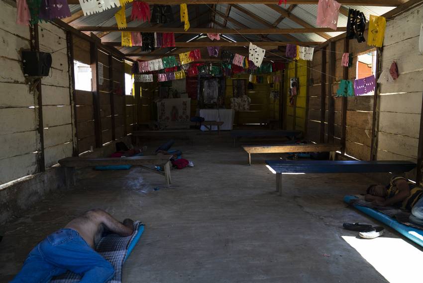 Honduran migrants Juan Ramón Andino, 60, left, and José, 40, right, sleep in a church that also serves as a migrant shelter in the community General Emiliano Zapata del Valle near Palenque, Chiapas on Oct. 24. The shelter is located along Highway 307 known as "El gran corredor del pacífico del migrante," or "The Great Pacific Corridor of the Migrant." This is a common route for Honduran migrants due to its proximity to their country.