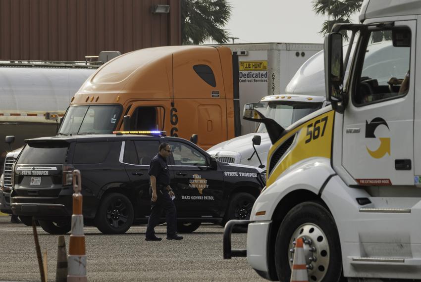 Commercial trucks wait to be inspected by Texas Department of Public Safety troopers at an inspection station near the Veterans International Bridge in Brownsville on May 5, 2023.