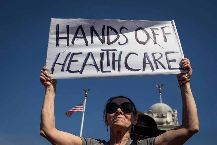 Brenda Patoine of Vermont joins over a thousand people at a march against efforts to dismantle and defund the healthcare system on March 12, 2025 in Washington.