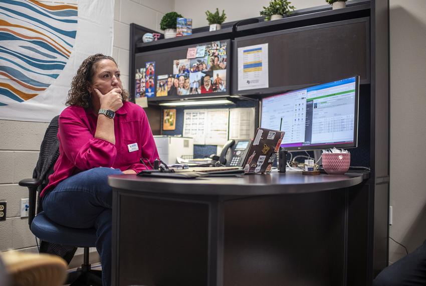 Assistant Principal Dusty Kinslow at her desk at Lago Vista High School on Tuesday, Sept. 9, 2025 in Lago Vista, TX. HB 1481 passed during the special legislative session which requires schools to implement a policy prohibiting personal communication devices. Lago Vista has implemented a policy where students stow devices, primarily cell phones, in magnetically locked pouches that also block cell phone service, the devices can be unlocked in the event of an emergency as well as when the students exit the building using a wall mounted key near the building entrance. (Sergio Flores for The Texas Tribune)