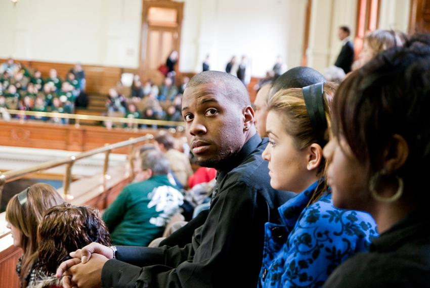 Brandon Demings sits in the Senate gallery on Community College Day at the Texas Capitol. He says students at Kilgore College are already feeling the pinch of state budget cuts.
