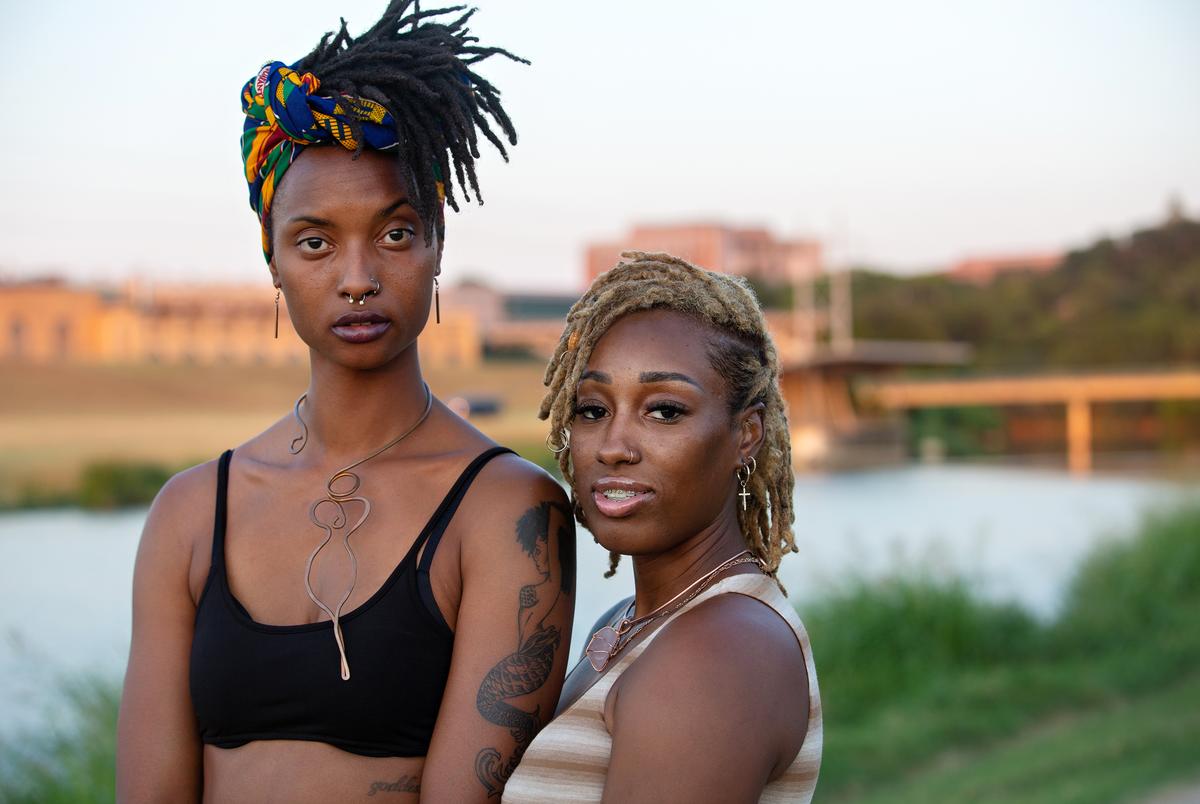 Friends Ashton Thomas and Kiriston Arceneaux posed for a portrait together during the 