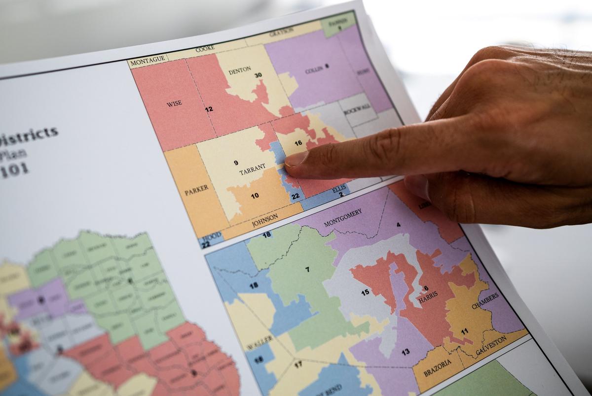 Salman Bhojani, a former candidate for Texas Senate District 9, shows where he lives on an updated map that now draws him out of District 9 and now into District 2, at his offices in Irving, on Oct. 17, 2021. Bhojani suspended his campaign after state legislature adopted new district maps which draws Bhojani's home out of District 9.