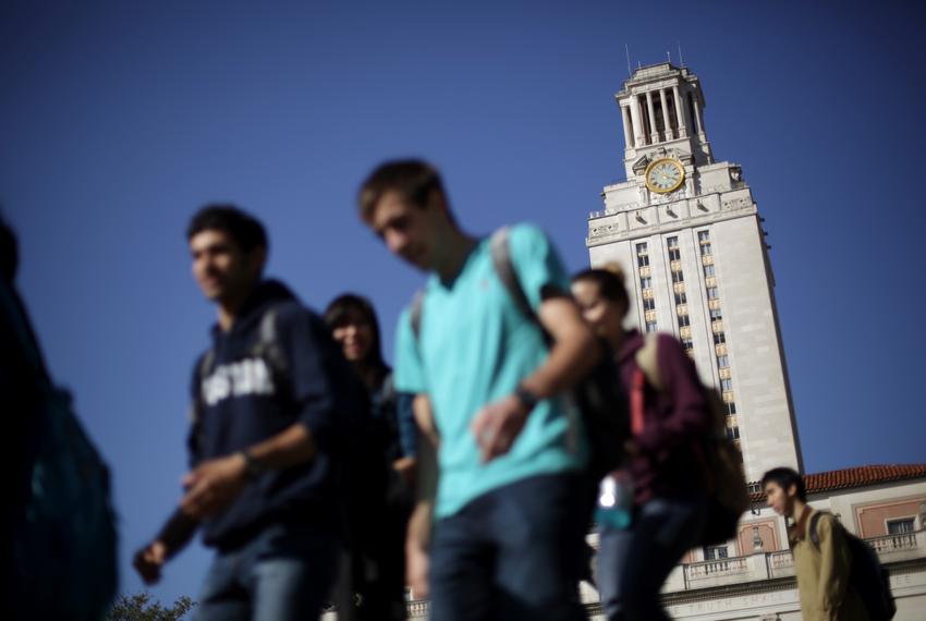 University of Texas at Austin students pass by the main building on their way to and from classes.