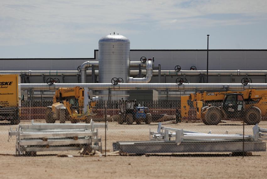 A chilled water buffer tank is connected to a data center building during a tour of the OpenAI data center in Abilene, Texas, U.S., September 23, 2025. Each building is estimated to need 1 million gallons of water that it will recycle.