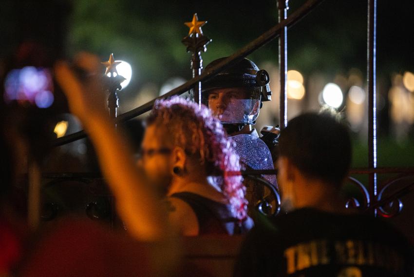 A Texas DPS trooper guards a section of the capitol gates during a protest on May 31, 2020.