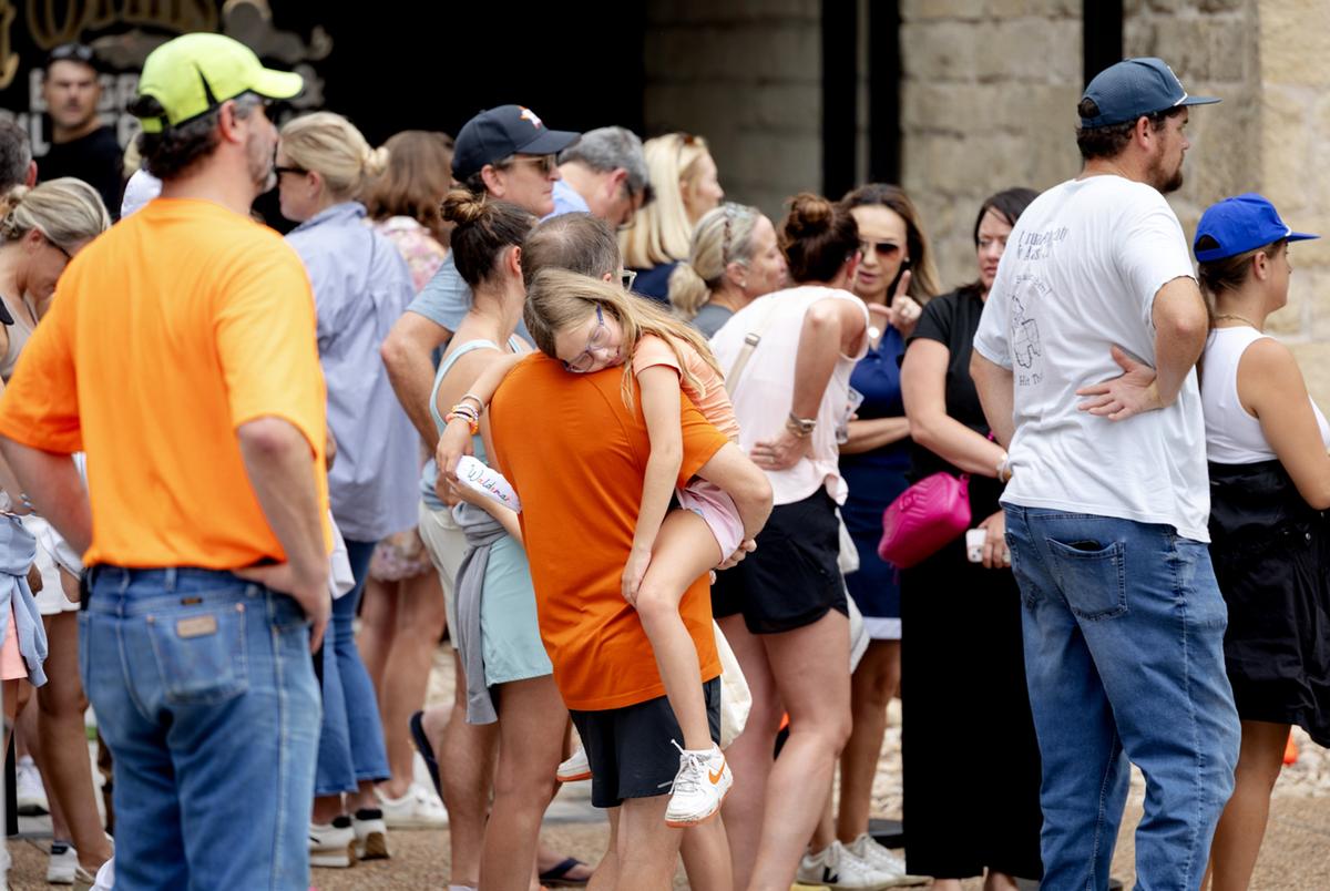Campers from Camp Waldemar in Hunt are reunited with their families following a deadly flood at a reunification center at the Arcadia Live Theatre in Kerrville, Texas on July 5, 2025.