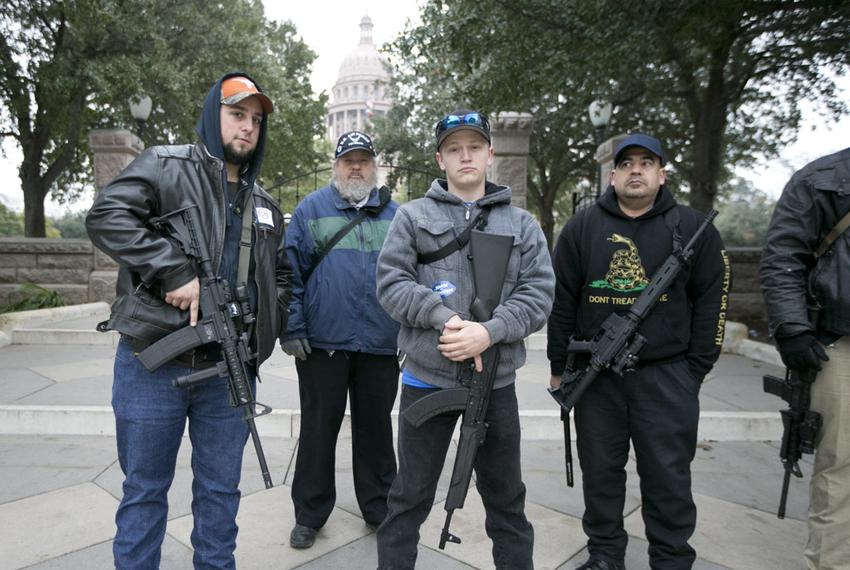 Activists who support a legislative proposal that would lift the state's handgun licensing requirements stand outside the state Capitol on the opening day of the Texas Legislature on Jan. 13, 2015.