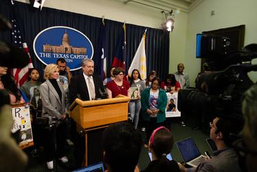 Families of the victims of the Uvalde and Santa Fe school shootings gathered with state Sen. Roland Gutierrez, D-San Antonio, to show their support for legislation on gun safety laws at the state Capitol in Austin on Feb. 14, 2023.