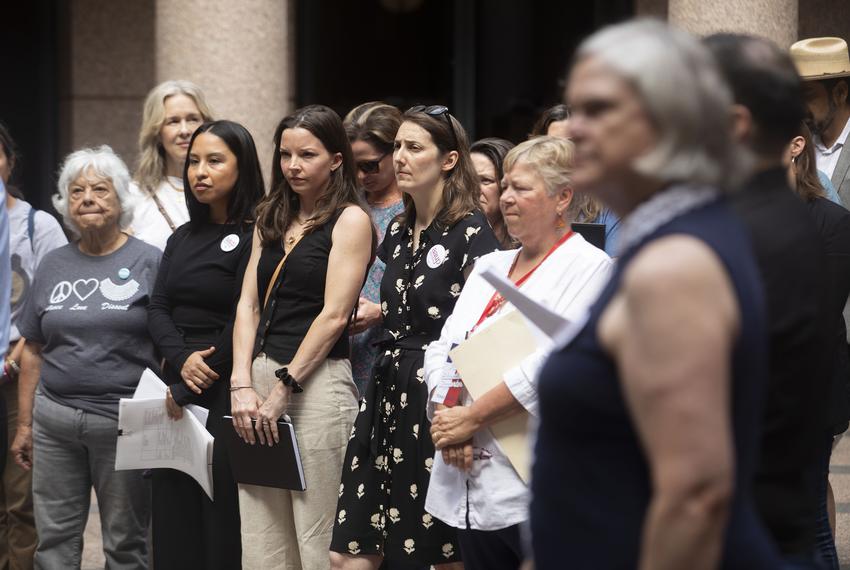 University students and faculty gather at the Texas Capitol’s outdoor rotunda on May 15, 2025 to speak against Senate Bill 37, which would allow the government to reshape courses and governance in higher education.