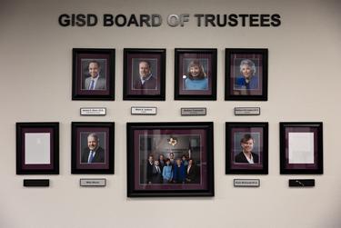 Two empty frames hang along with the portraits of the Granbury ISD Board of Trustees prior to the election of two new board members, Melanie Graft and Courtney Gore, at the GISD Administration Building in on Nov. 15, 2021.