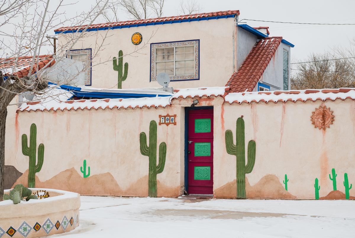 A house painted with cacti is covered in snow and ice in El Paso, Texas on February 15, 2021.