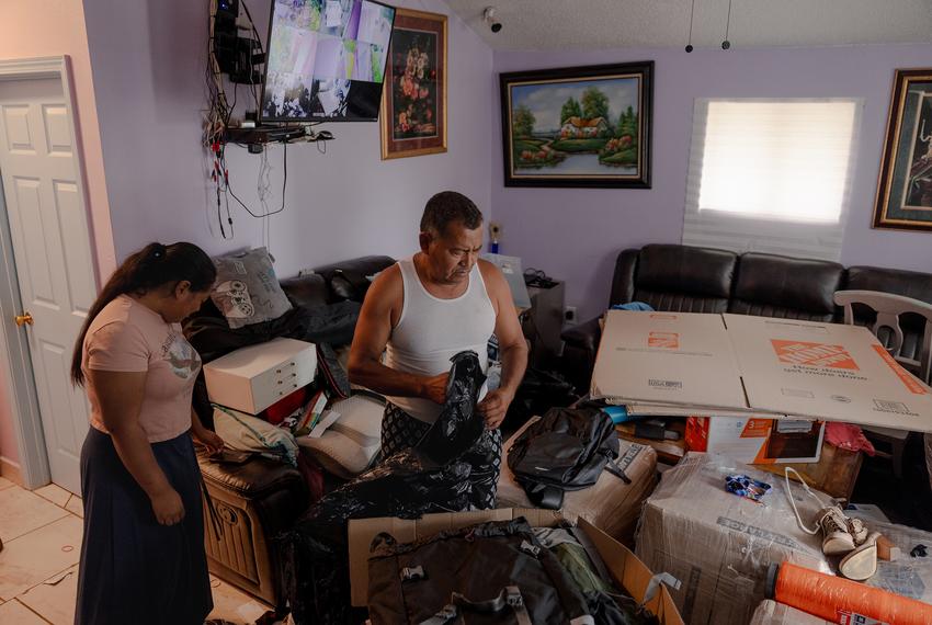 José Avila packs up boxes to send belongings to his wife, Margarita, who has been sent to her home country of Belize after signing a deportation order, Wednesday, June 25, 2025, in Houston. 

(Lexi Parra for The Texas Tribune)