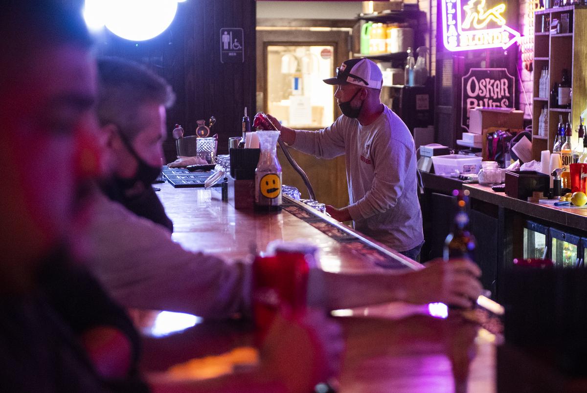 Dustin Allison works behind the bar at Savage Tavern in Lubbock on Saturday, Oct. 24, 2020.