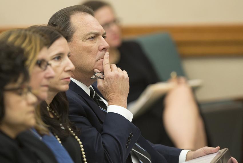 Texas Department of Family and Protective Services Commissioner Henry "Hank" Whitman waits to testify during a October 26, 2016 Senate Finance Committee hearing.