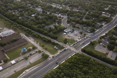 A line of about 100 cars formed at Barbara Jordan Elementary School in Austin at a COVID-19 testing site. June 26, 2020.
