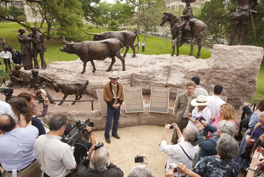 Tejano monument artist Armando Hinojosa in front of the sculpture after its unveiling ceremony on the grounds of the Texas Capitol on March 29, 2012.