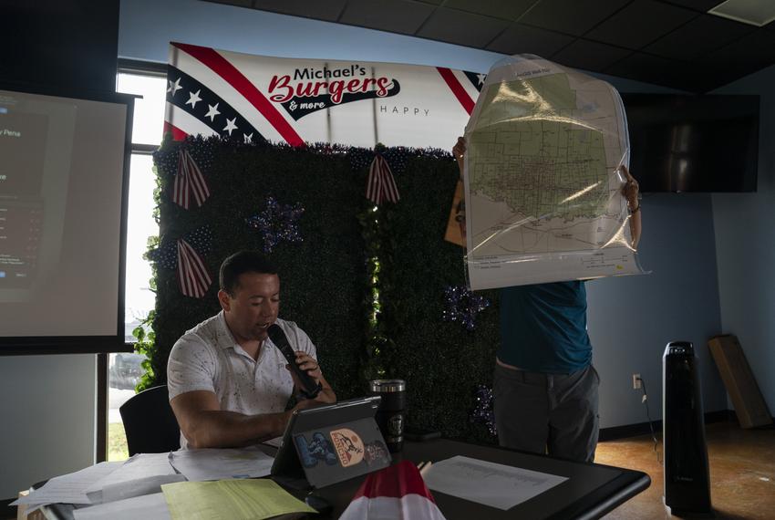 Richard Gonzales, the Hidalgo County Democrats chairman, speaks during their Third Quarter meeting as someone holds a map showing the election precincts in San Juan, Texas on July 26, 2025. They were hoping to introduce the new precinct chairs during the meeting as well as listening from their newly formed committees.
Gabriel V. Cárdenas for The Texas Tribune