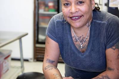 Francis Castillo poses for a portrait at the bakery where she works. Castillo, who is living at the Hope Haven shelter, has recently gotten everything she needs to seek out housing of her own.