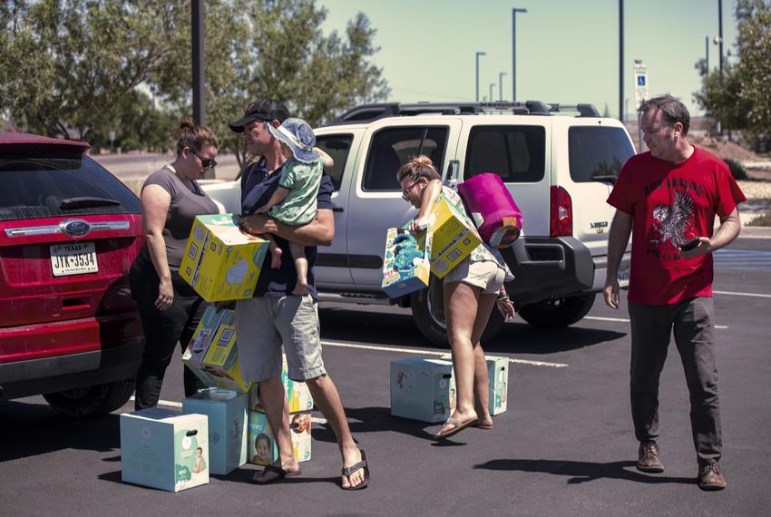 From left: Meagan O'Toole-Pitts, Mark Cortez, holding his son Oliver, Ashley Cortez and Austin Savage attempt to deliver diaper and toys to an immigrant detention center in Clint on June 24, 2019. The facility is currently housing an estimated 250 children.