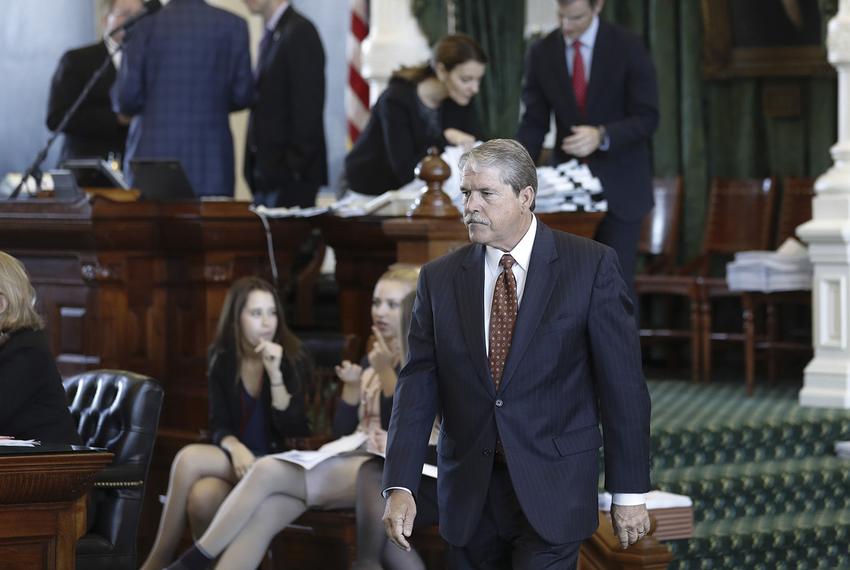 State Sen. Larry Taylor walks across the Senate floor on May 24, 2017.