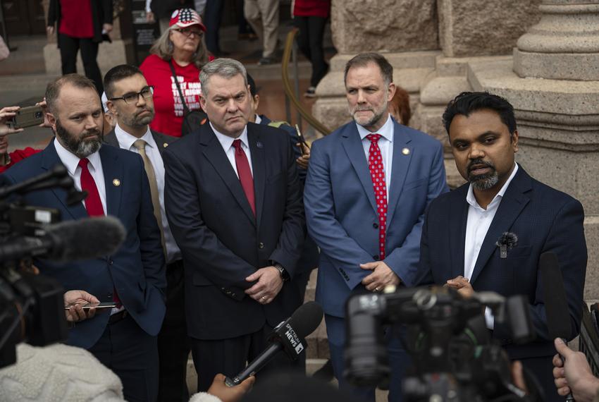 Republican Party of Texas Chair Abraham George speaks to the press on the steps of the state Capitol following the vote for House speaker on Tuesday, Jan. 14, 2025. Looking on are Republican freshman state Reps. Wes Virdell, David Lowe, Andy Hopper and Brent Money.