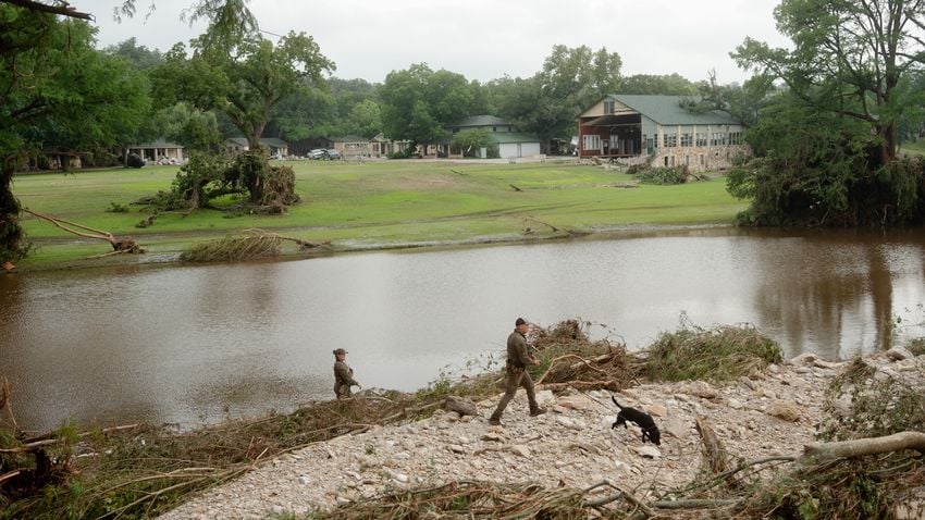 Texas game wardens search the area across the river from Camp Mystic on July 5, 2025.