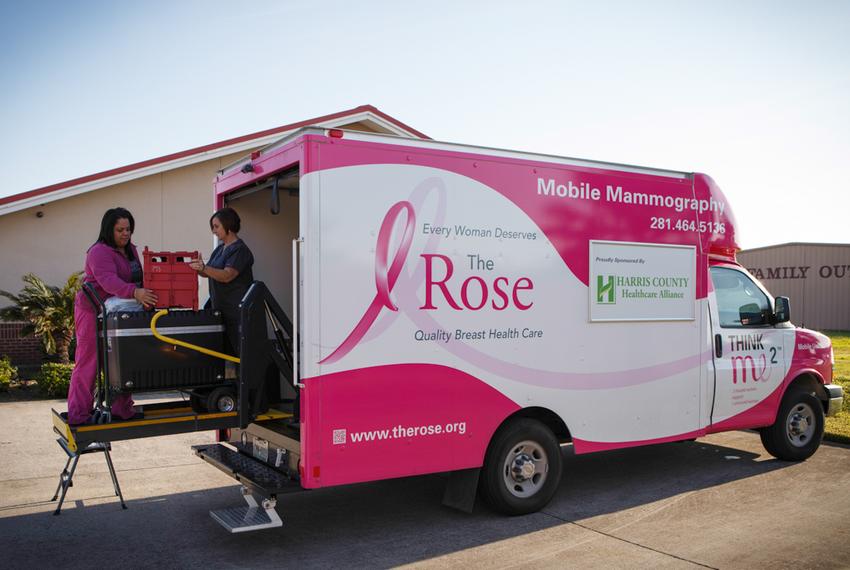 Donna Fehl, right, and Lilia Avila, left, of the Rose unload and set up a mobile mamogram machine at a clinic in Port Arthur, Texas, Monday, November 11, 2013.