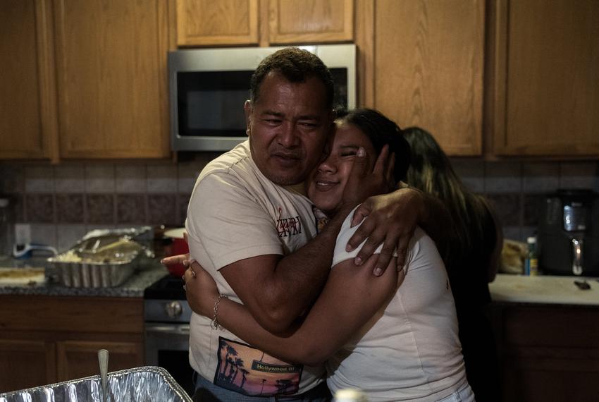 José Avila hugs his eldest daughter, Lisbet Avila, at her birthday celebration, Saturday, May 24, 2025, in Houston.

(Lexi Parra for The Texas Tribune)