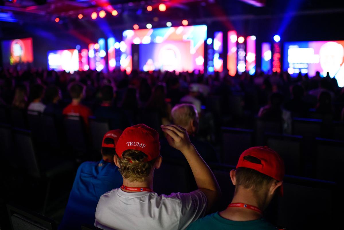 Houston, Texas: People watch Governor Greg Abbott speak during the Texas Youth Summit on September 20, 2025 in The Woodlands, Texas. Mark Felix/The Texas Tribune