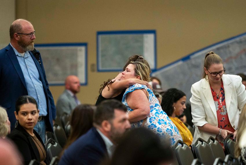 Alicia Jeffrey Baker receives a hug after testifying during a joint committee hearing at Hill Country Youth Event Center on Thursday, July 31, 2025 in Kerrville, Texas. Baker lost her parents Emlyn and Penelope Jeffrey and her daughter Madelyn “Emmy” Jeffrey in the flooding.