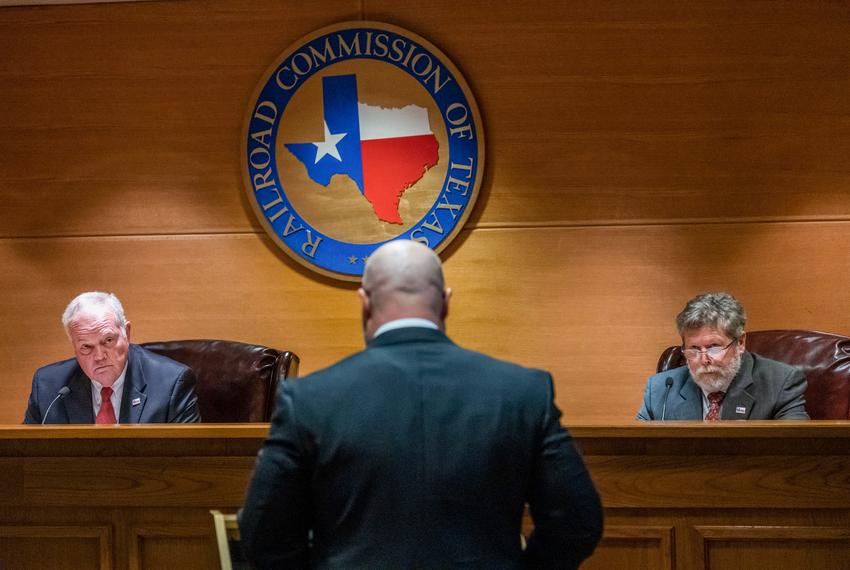 Wayne Christian, Chairman of the Texas Railroad Commission, and Commissioner Jim Wright listen during an RRC hearing in the William B. Travis building in Austin on Nov. 30, 2021.