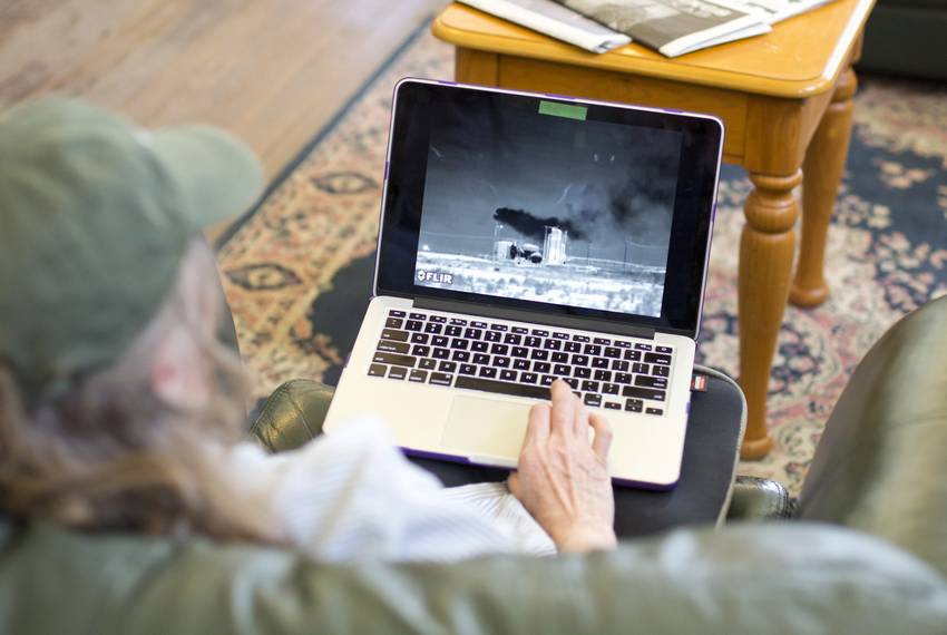 Sharon Wilson, a senior organizer for Earthworks' Oil and Gas Accountability Project, shows a video of pollution spewing out of a tank battery that she recorded with an optical gas imaging camera. The emissions are invisible to the naked eye.