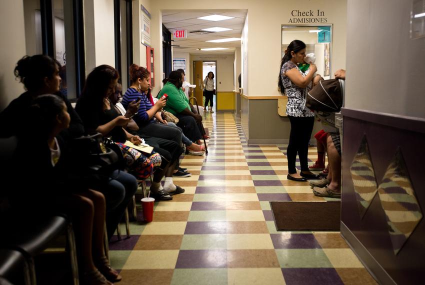 Patients wait to be seen at the People's Community Clinic in Austin, which provides state-subsidized health services to low-income families and individuals.