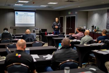 Current Texas Land Commissioner and candidate for attorney general George P. Bush speaks to National Border Patrol Council labor union reps on Dec. 7, in El Paso.