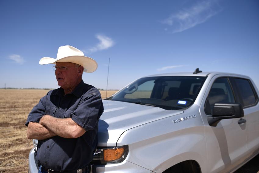 Walt Hagood leans on his truck on his cotton farm in Wolfforth on May 12, 2025. .