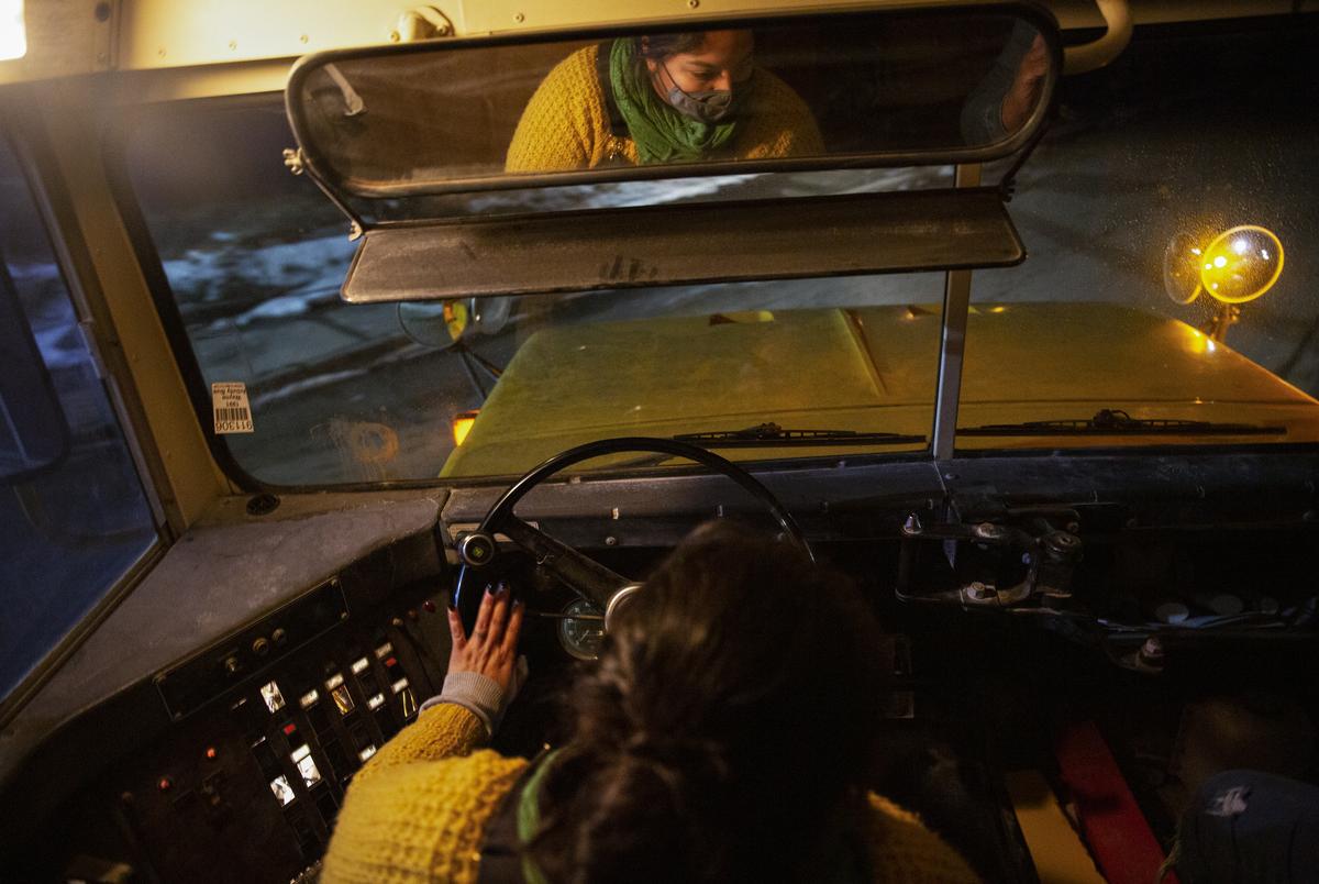 DanaÎ Gutierrez, founder of Harvest Project Food Rescue, drives the bus carrying hundreds of meals, blankets, and warm clothes to distribute in Dallas after the winter storm.