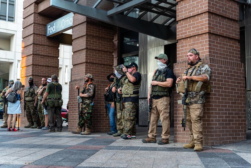 Members of the far right ‘Proud boys’ militia stood across S. Congress Ave from the Garret Foster memorial in downtown Austin, and watched as protesters clashed with police on August 1, 2020.