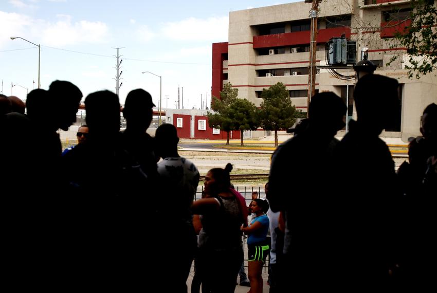 Dozens of migrants wait outside Ciudad Juárez's Centro de Atención a Migrantes waiting to see if they'll be able to enter the United States.