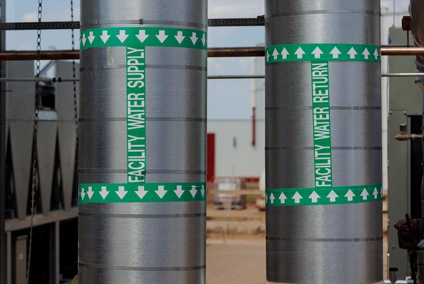 Pipes that are part of a chilled water loop used to cool GPUs are connected to a data center building during a tour of the OpenAI data center in Abilene, Texas, U.S., September 23, 2025. Each building is estimated to need 1 million gallons of water that it will recycle.