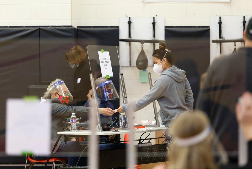 People vote inside the gym at the Metropolitan Multi-Services Center in Houston on Nov. 3, 2020.