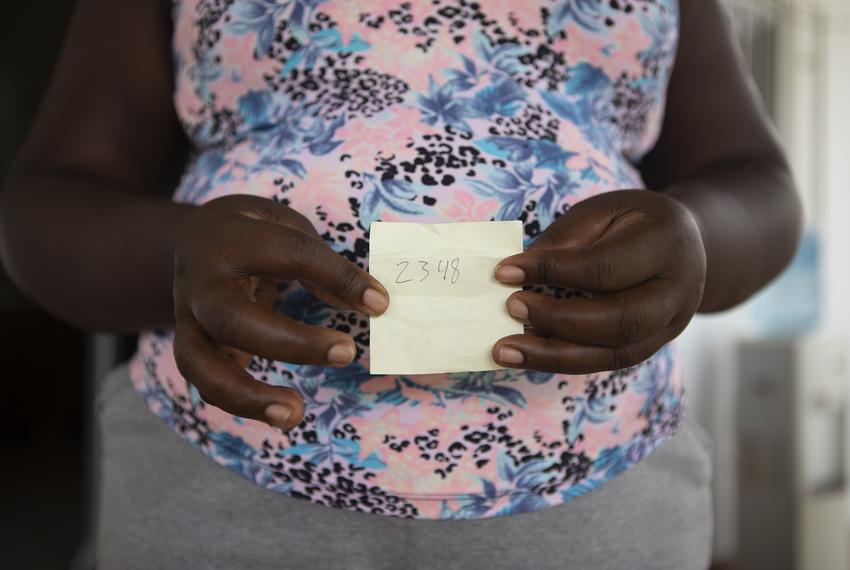 Helen holds up a yellow sticky note with the handwritten number 2348. This note was given to her by Mexican authorities. 