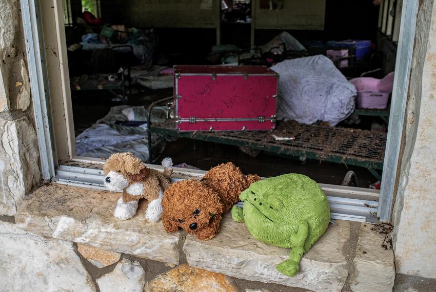 Stuffed animals sit in a windowsill at Camp Mystic after a deadly flooding in Kerr County, Texas, on July 5, 2025.
