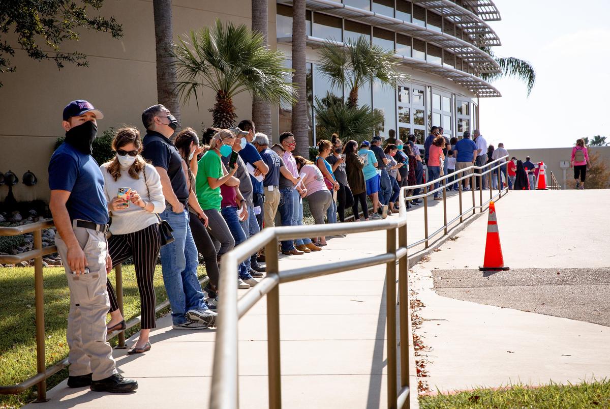 People waited in line at Doctors Hospital at Renaissance Conference Center in Edinburg to receive the Pfizer vaccine on Dec. 19, 2020