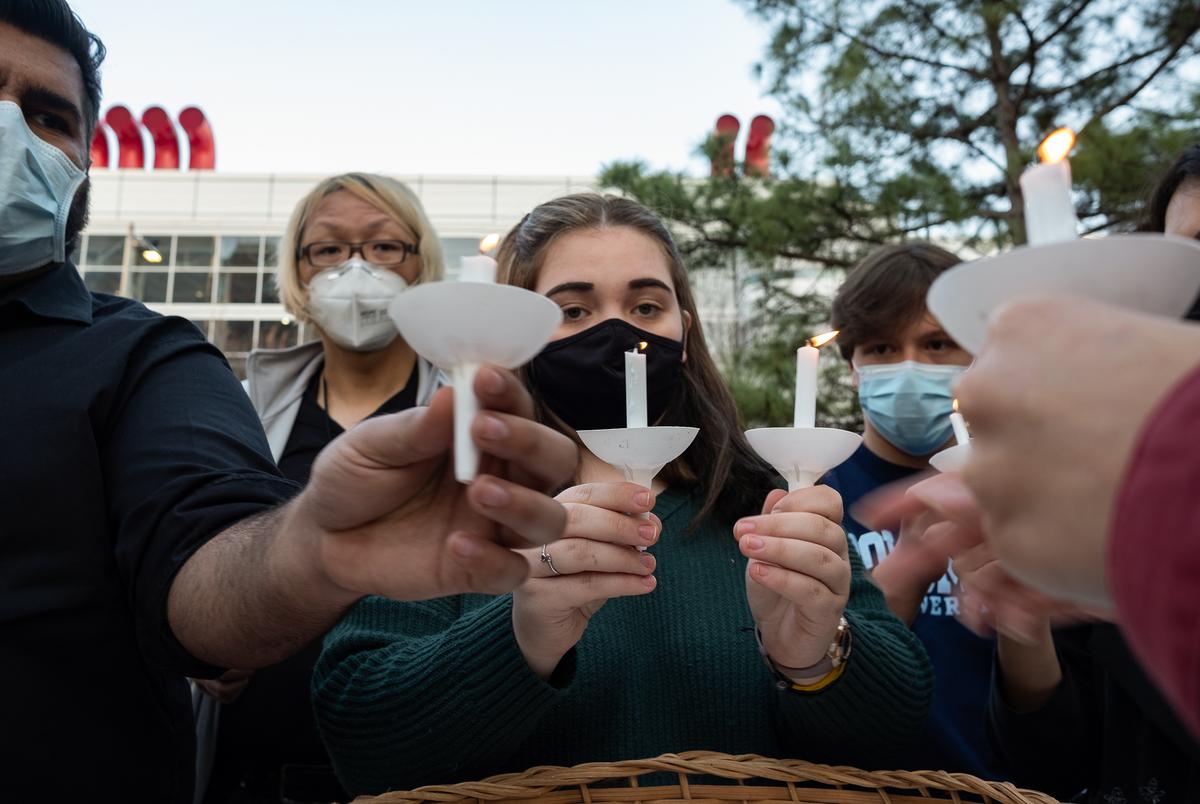 Volunteers light candles at Discovery Green on March 20, 2021, in Houston. People gathered for the Stop Asian Hate Vigil and Rally after a man killed eight, including six Asians, in a mass shooting at three Atlanta spas.