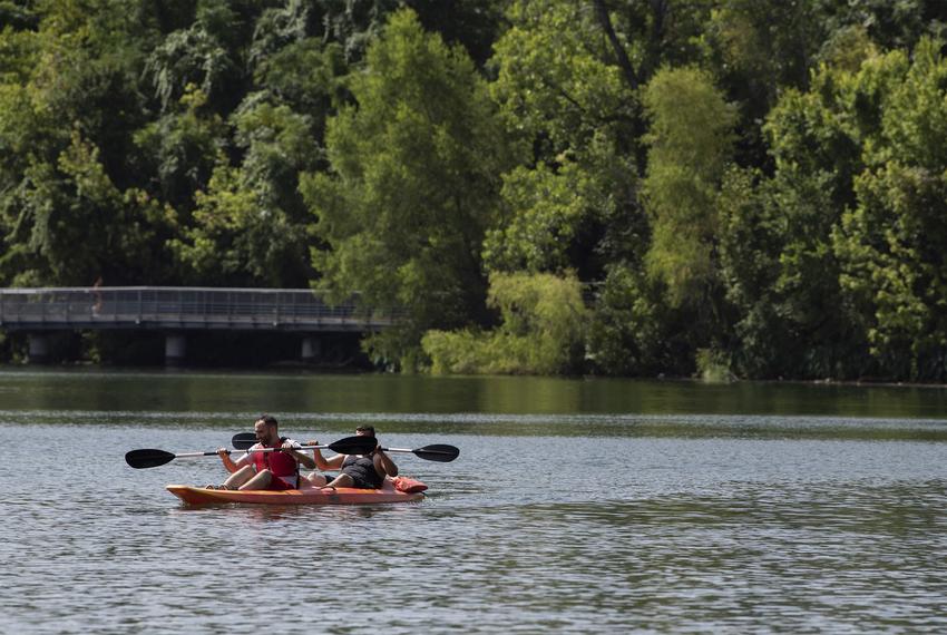 Two men kayak at Lady Bird Lake on Saturday, July 4, 2020 in Austin.