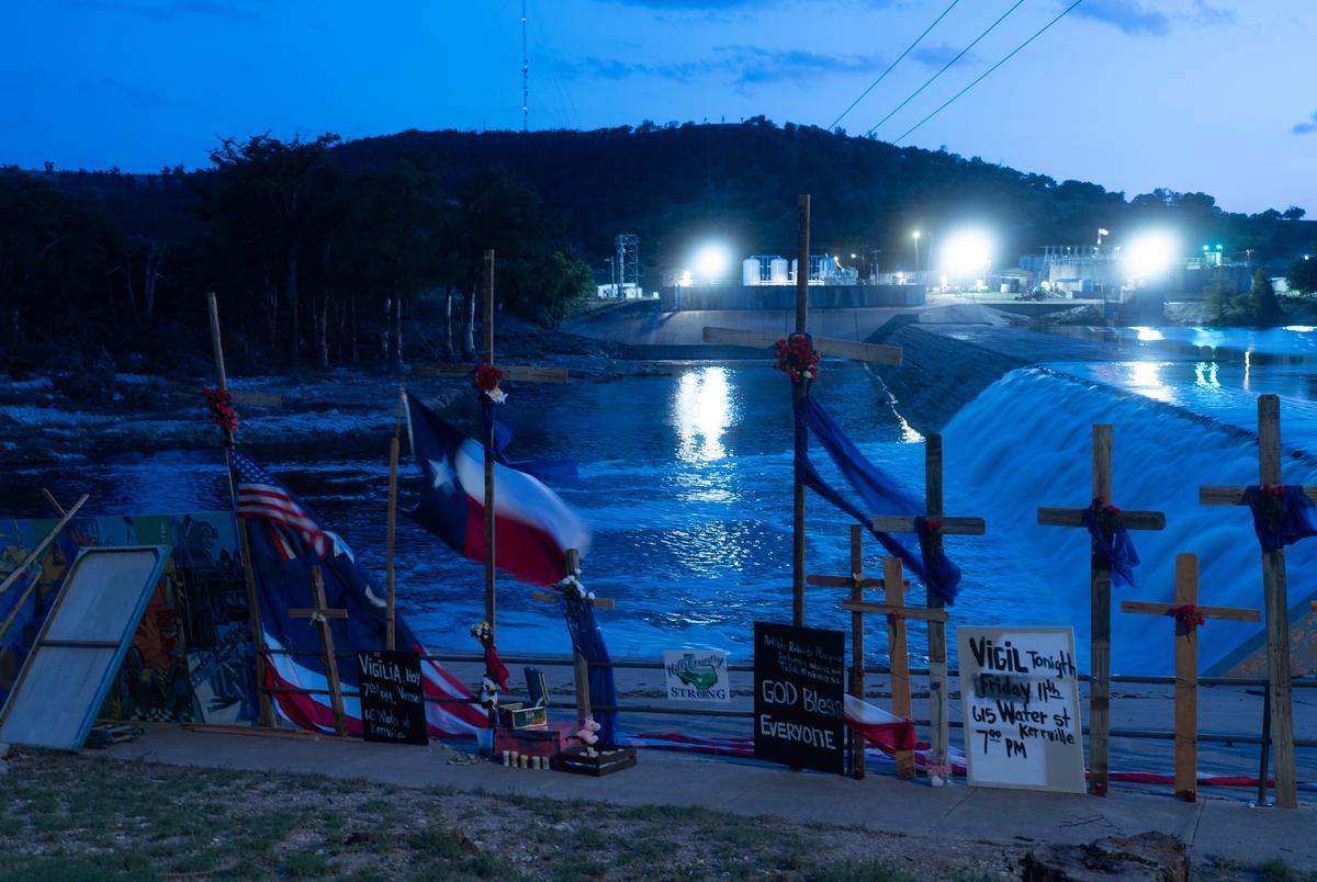 Crosses honoring the victims of the flood were erected by artist Roberto Marquez next to the Guadalupe River in Guadalupe Park, seen on Friday July 11, 2025.