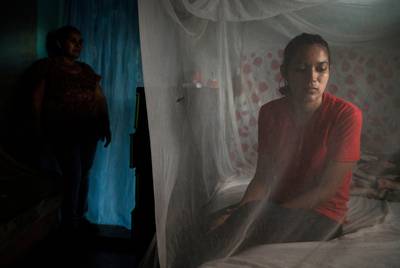 Claudia and her mother, Suyapa, in their home in Olancho, Honduras. Claudia is experiencing what her mother went through when her oldest son migrated to the U.S. a few years ago.