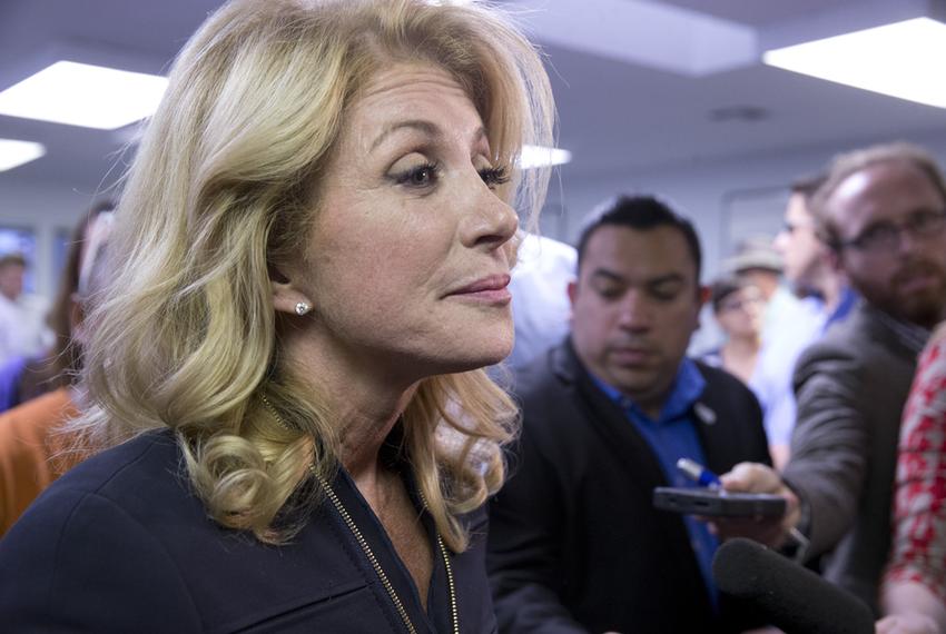 State Sen. Wendy Davis speaking to the press after a Travis County Democratic campaign rally on Oct. 22, 2014.